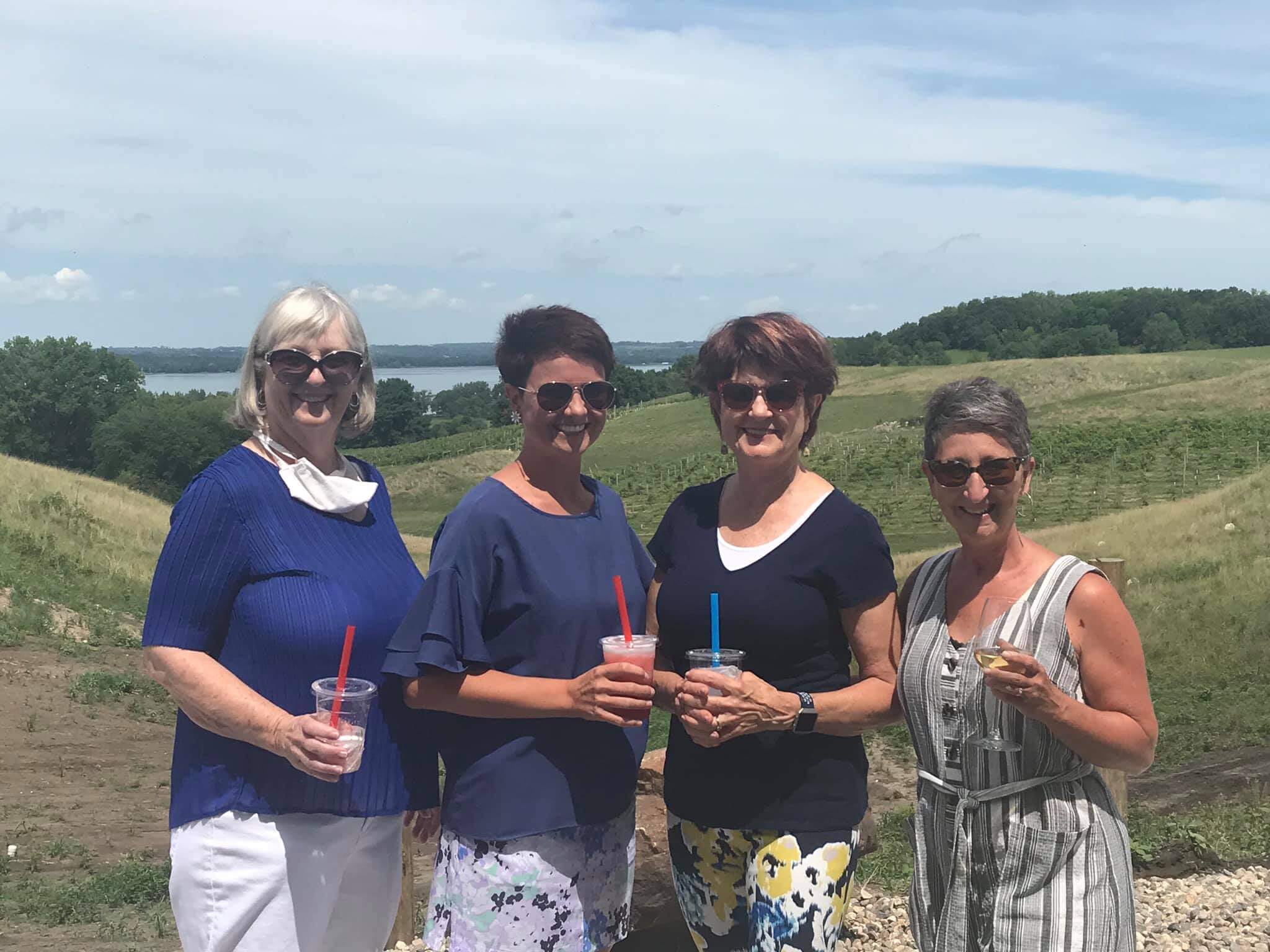 Winery customers pose for a photo on the patio at ROlling Forks Vineyards, Glenwood, Minnesota