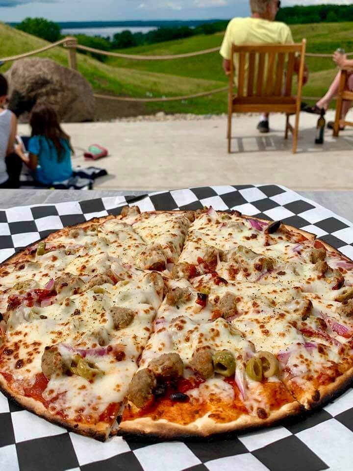 Winery Customers enjoying pizza and wine on the patio at Rolling Forks Vineyards, Glenwood, Minnesota