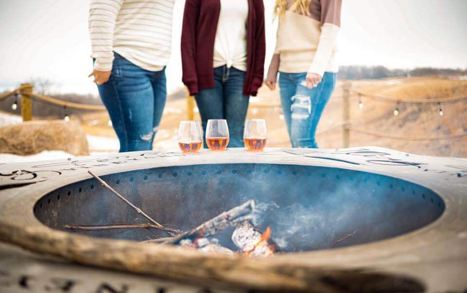 winery customers drink local on the patio at Rolling Forks Vineyards, Glenwood, Minnesota