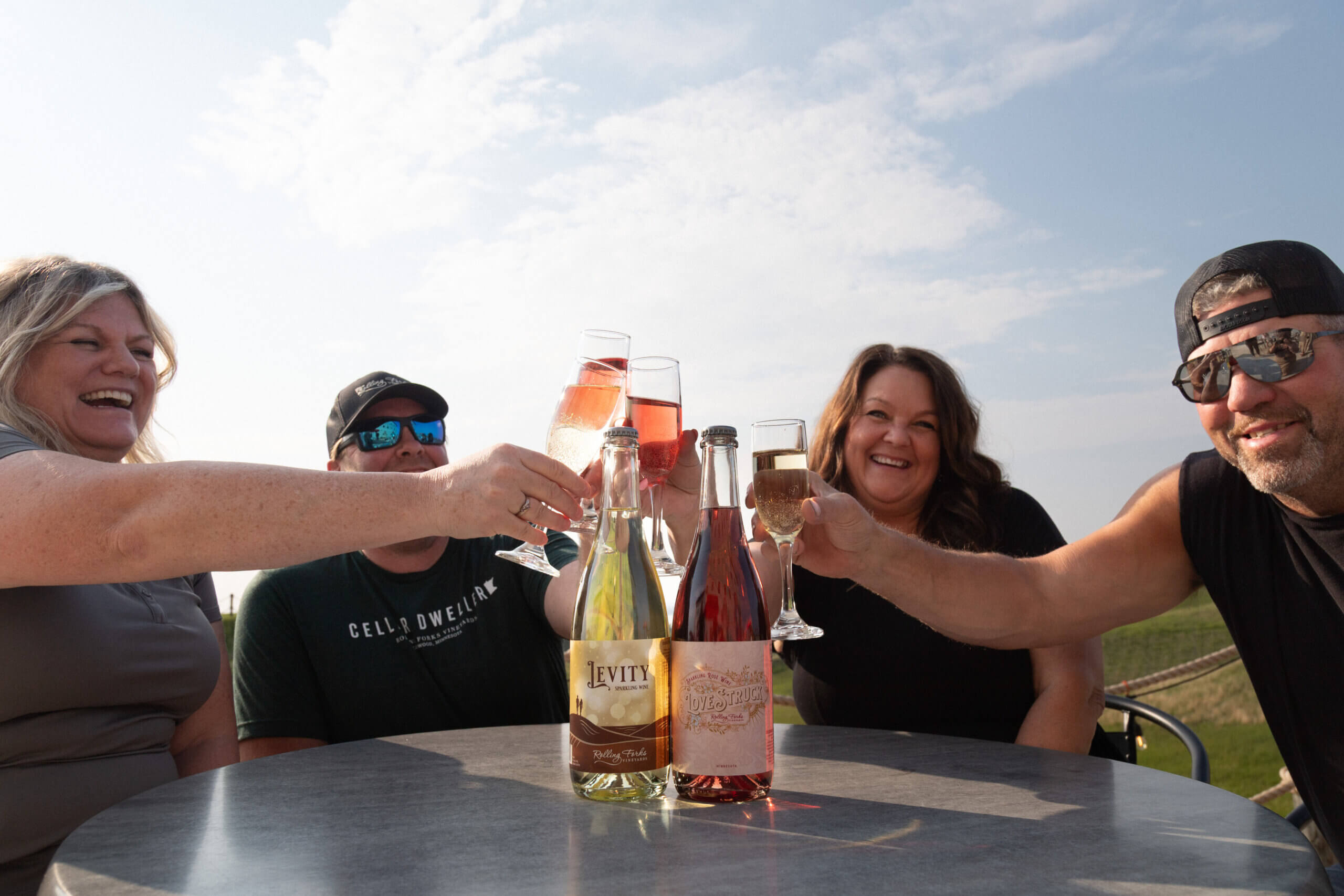 Friends toast with sparkling wine from Rolling Forks Vineyards, Glenwood, Minnesota