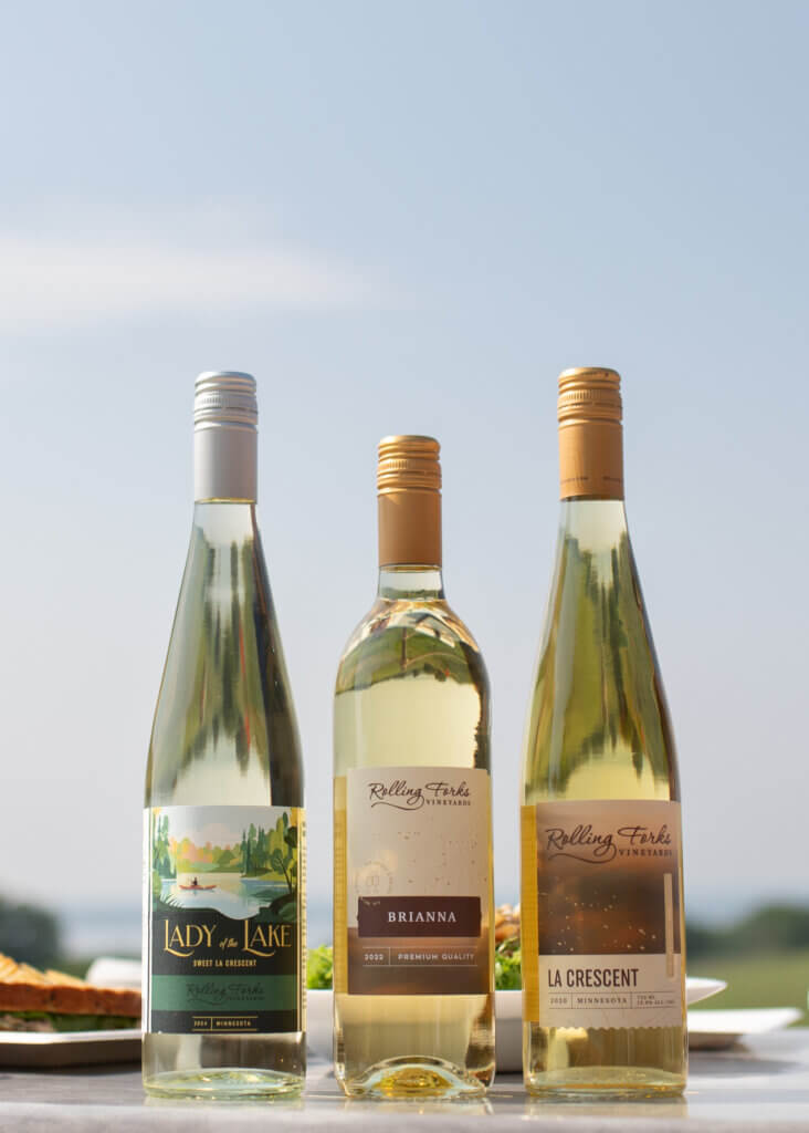 Lady of the Lake: A bottle of 2024 Lady of the Lake La Crescent, a sweet white wine from Rolling Forks Vineyards, featuring its Best of Class medal from the San Francisco Chronicle Wine Competition. Brianna: Rolling Forks Vineyards Brianna white wine bottle with its Gold medal, showcasing its signature tropical fruit profile. La Crescent