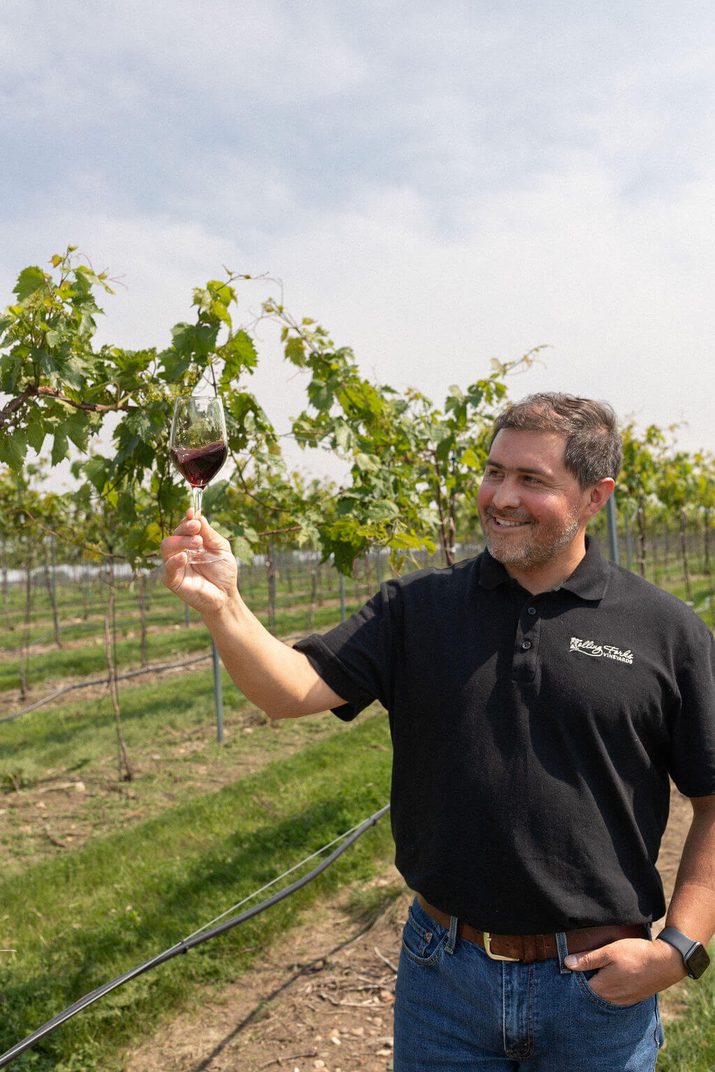 Winemaker Patricio, guiding a tasting of Marquette red wine among the vines at Rolling Forks Vineyards in Glenwood, Minnesota