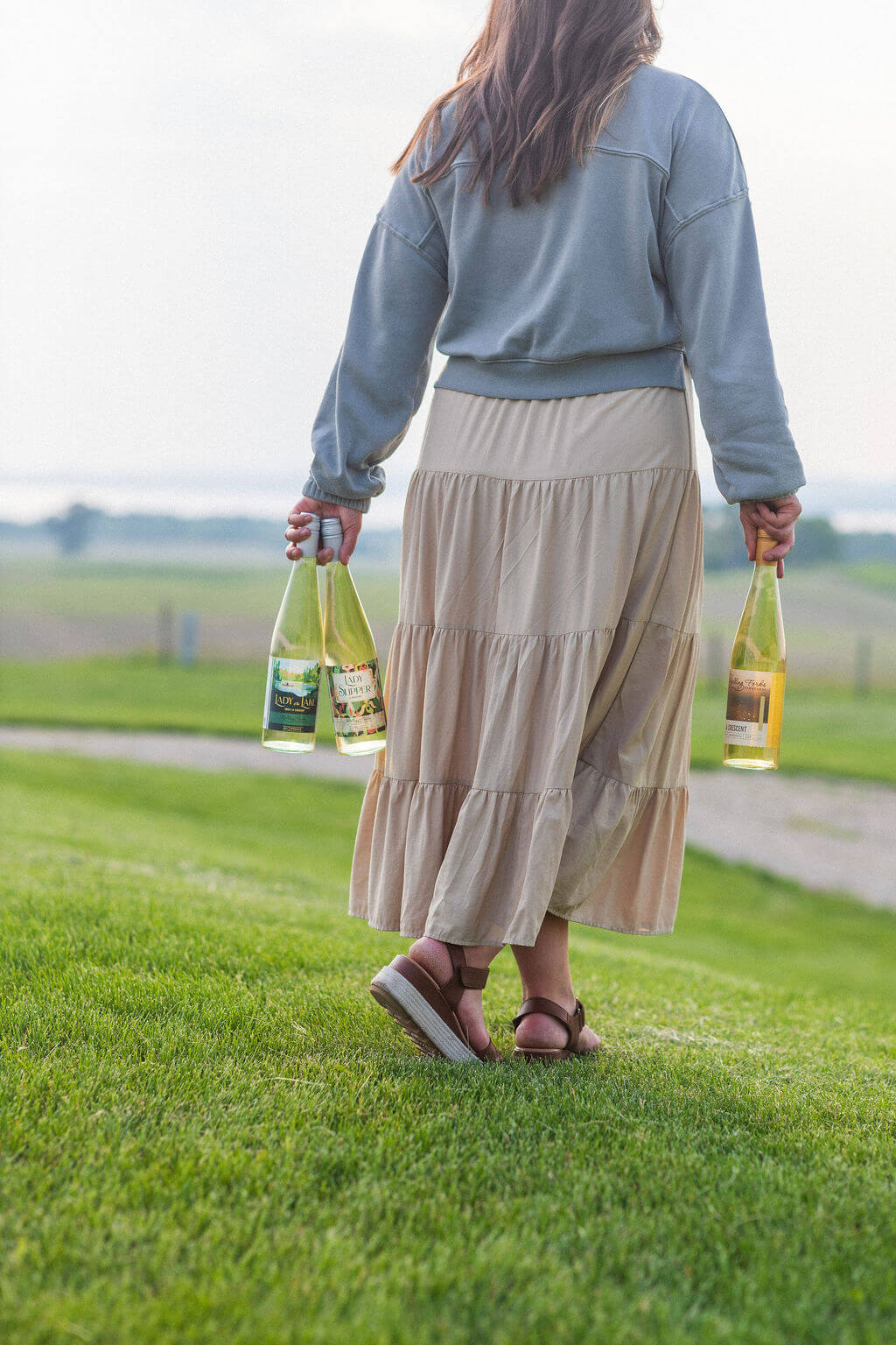 Woman carrying wine at Rolling Forks Vineyards in Glenwood Minnesota